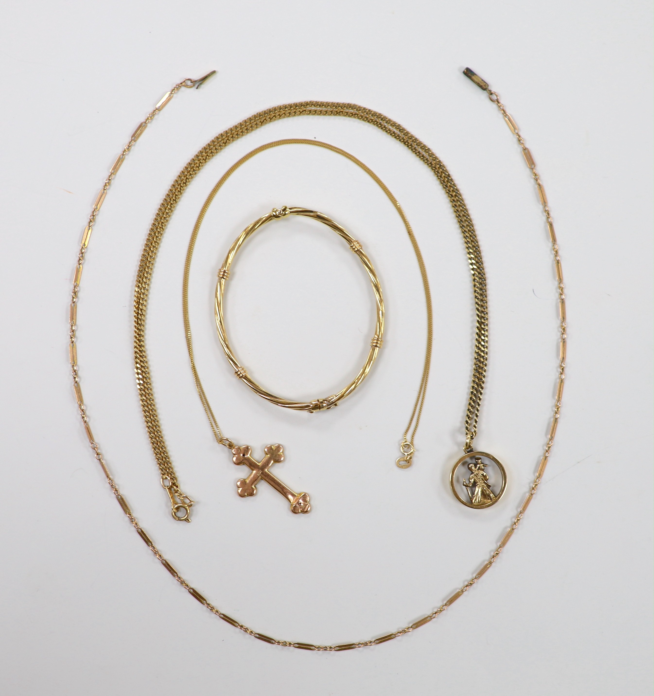 Two 9ct pendant necklaces, one with cross pendant, a 9ct gold hinged bangle and a 9ct chain, 23.4 grams.